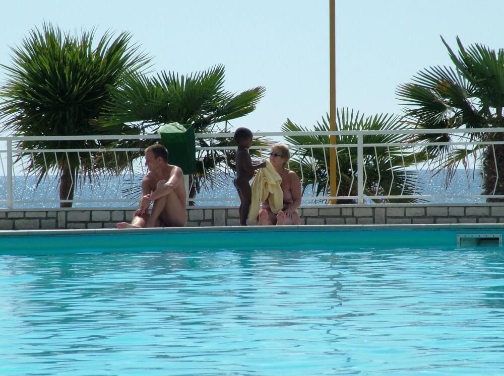 Photo of naturists in an outdoor pool - Naturism as a Way to Connect with Nature