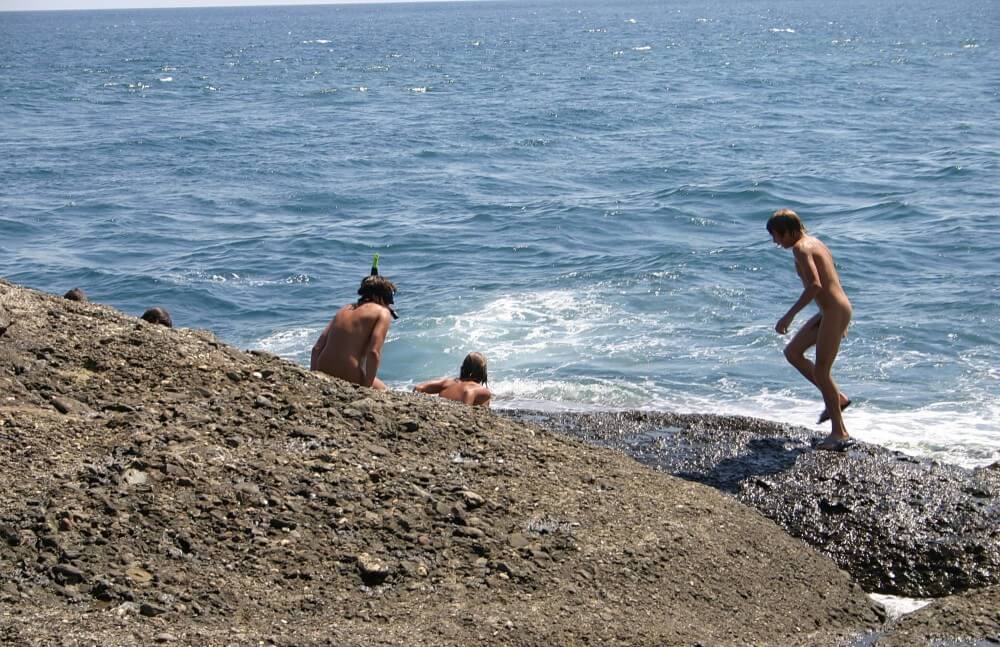 Leaning Against Hit Rocks pics - Nudists appreciate and love nature